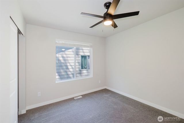 9422 Fairhaven Cir NE, Bremerton, WA 98311 - unfurnished bedroom with carpet, baseboards, a closet, and ceiling fan