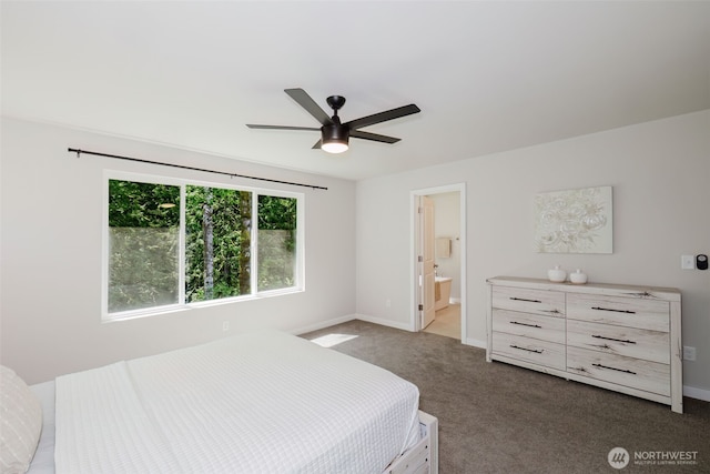 9422 Fairhaven Cir NE, Bremerton, WA 98311 - bedroom with dark colored carpet, baseboards, ensuite bath, and ceiling fan