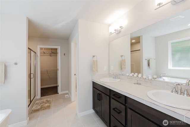 9422 Fairhaven Cir NE, Bremerton, WA 98311 - bathroom with a bath, a shower stall, double vanity, and tile patterned floors