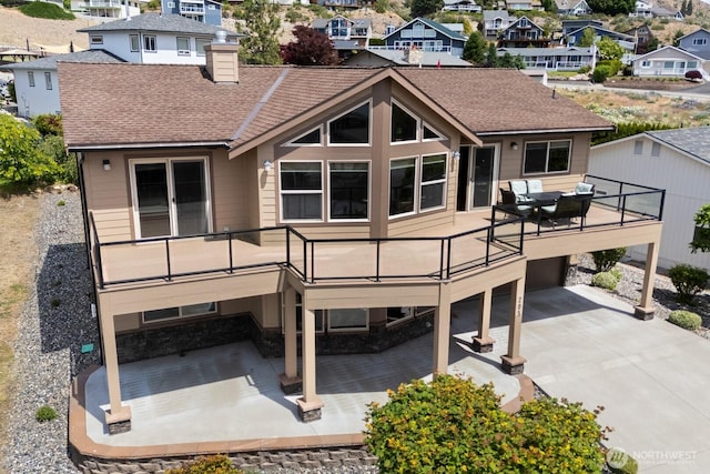 205 Butte Rd, Chelan, WA 98816 - rear view of house with a residential view, a patio, a chimney, and a shingled roof