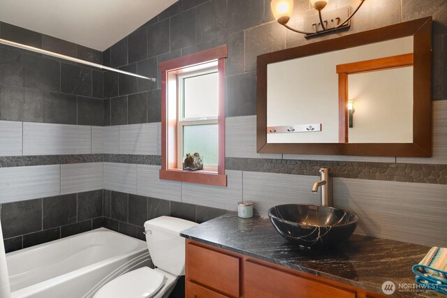 205 Butte Rd, Chelan, WA 98816 - full bath with toilet,  shower combination, vanity, backsplash, and tile walls