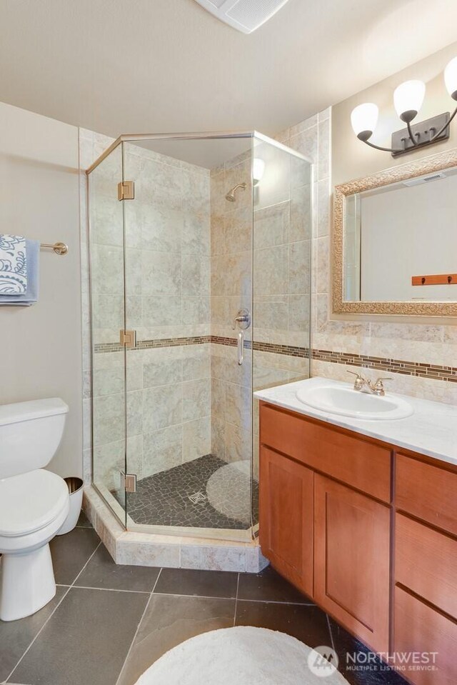 205 Butte Rd, Chelan, WA 98816 - bathroom with toilet, vanity, a shower stall, and tile patterned floors