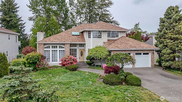 5318 Galleon Dr NE, Tacoma, WA 98422 - view of front facade with concrete driveway, an attached garage, roof with shingles, a chimney, and a front yard