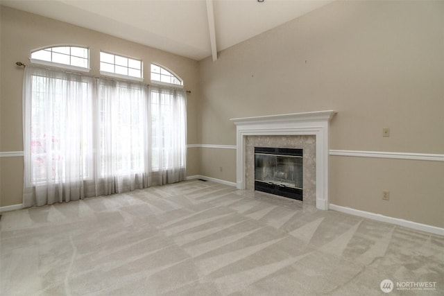 5318 Galleon Dr NE, Tacoma, WA 98422 - unfurnished living room with carpet flooring, a tiled fireplace, baseboards, beamed ceiling, and high vaulted ceiling