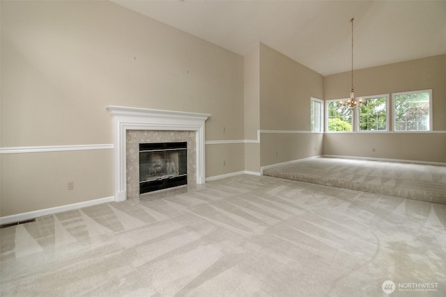 5318 Galleon Dr NE, Tacoma, WA 98422 - unfurnished living room featuring carpet, a chandelier, a tile fireplace, baseboards, and high vaulted ceiling