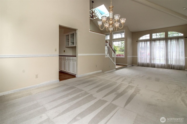 5318 Galleon Dr NE, Tacoma, WA 98422 - carpeted spare room featuring high vaulted ceiling, a chandelier, stairway, and baseboards