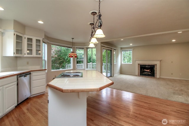 5318 Galleon Dr NE, Tacoma, WA 98422 - kitchen with appliances with stainless steel finishes, tile countertops, white cabinetry, recessed lighting, and glass insert cabinets