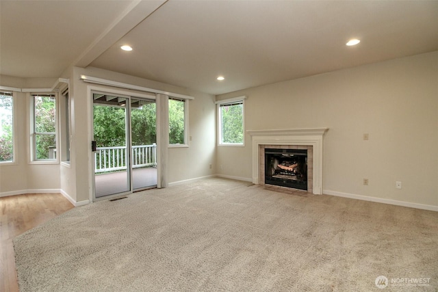5318 Galleon Dr NE, Tacoma, WA 98422 - unfurnished living room with baseboards, recessed lighting, a tile fireplace, and light colored carpet