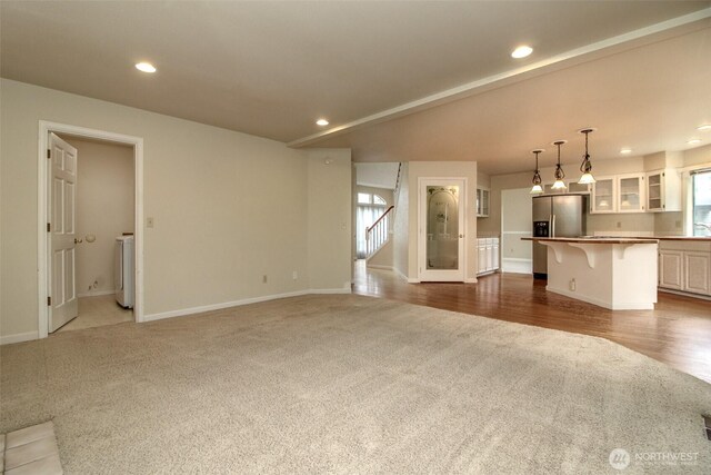 5318 Galleon Dr NE, Tacoma, WA 98422 - unfurnished living room with carpet flooring, washer / clothes dryer, baseboards, and recessed lighting