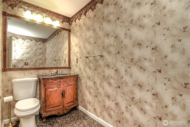 5318 Galleon Dr NE, Tacoma, WA 98422 - bathroom with wallpapered walls, baseboards, vanity, and toilet
