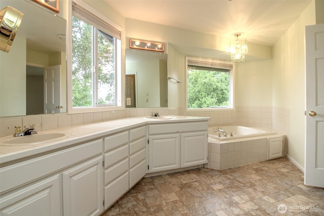 5318 Galleon Dr NE, Tacoma, WA 98422 - full bathroom featuring plenty of natural light, a garden tub, and double vanity