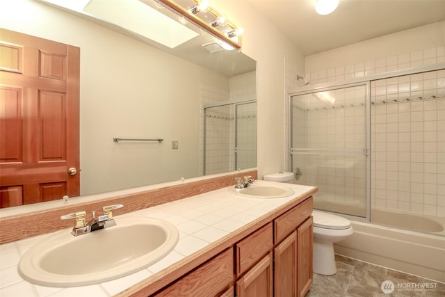 5318 Galleon Dr NE, Tacoma, WA 98422 - full bathroom with toilet, double vanity, and shower / bath combination with glass door