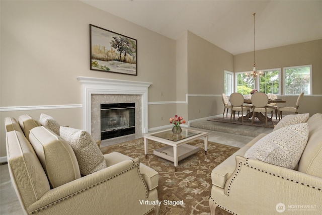 5318 Galleon Dr NE, Tacoma, WA 98422 - living room with a chandelier, baseboards, a fireplace, and lofted ceiling