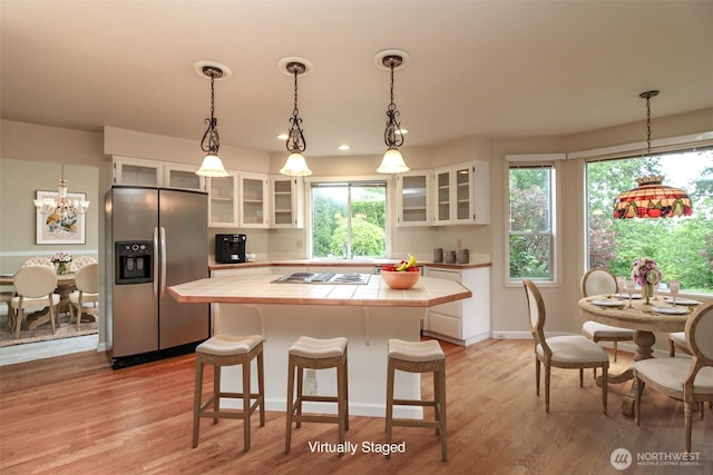 5318 Galleon Dr NE, Tacoma, WA 98422 - kitchen with appliances with stainless steel finishes, tile counters, white cabinetry, a kitchen island, and recessed lighting