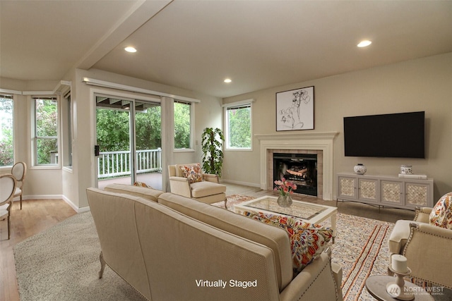 5318 Galleon Dr NE, Tacoma, WA 98422 - living room featuring baseboards, recessed lighting, wood finished floors, and a tiled fireplace
