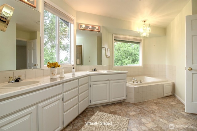5318 Galleon Dr NE, Tacoma, WA 98422 - full bathroom featuring healthy amount of natural light, double vanity, a bath, and a chandelier