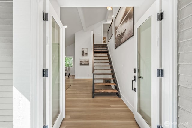 27302 NE 153rd Pl, Duvall, WA 98019 - foyer entrance with light wood-style floors, baseboards, stairs, and lofted ceiling