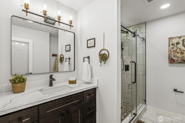 27302 NE 153rd Pl, Duvall, WA 98019 - full bathroom with vanity, baseboards, a shower stall, marble look tile flooring, and recessed lighting