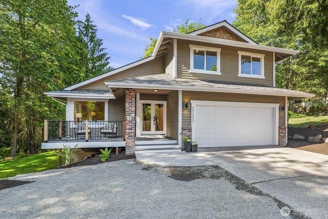 27302 NE 153rd Pl, Duvall, WA 98019 - view of front of house with concrete driveway, french doors, a porch, and a garage