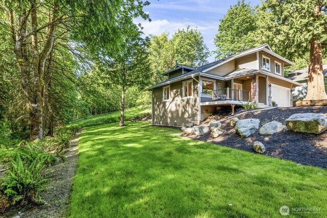 27302 NE 153rd Pl, Duvall, WA 98019 - view of side of home featuring a lawn and an attached garage