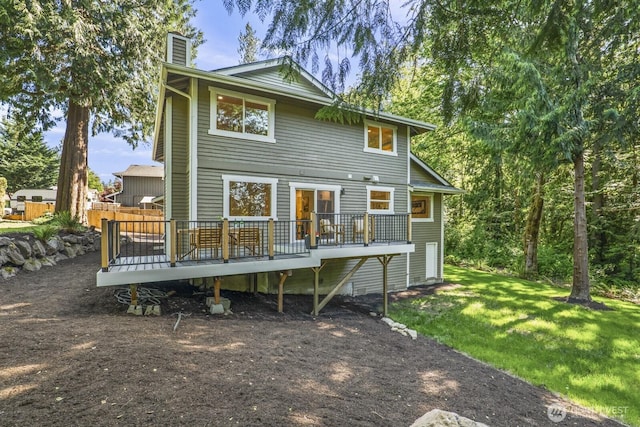 27302 NE 153rd Pl, Duvall, WA 98019 - rear view of property featuring a deck, a chimney, and a lawn
