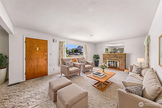 420 E Connecticut St, Bellingham, WA 98225 - carpeted living area featuring a brick fireplace and baseboards