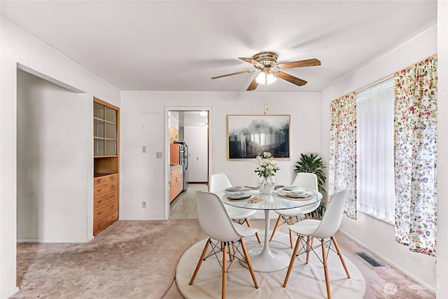 420 E Connecticut St, Bellingham, WA 98225 - dining area with ceiling fan, baseboards, light carpet, and healthy amount of natural light
