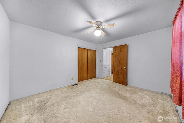 420 E Connecticut St, Bellingham, WA 98225 - unfurnished bedroom with carpet, a closet, and a ceiling fan