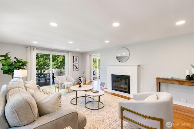 1703 NE 91st St, Seattle, WA 98115 - living area with wood finished floors, recessed lighting, and a fireplace with flush hearth