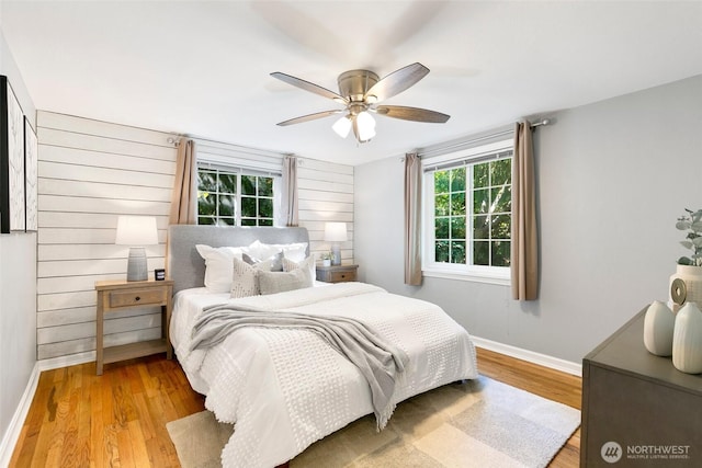 1703 NE 91st St, Seattle, WA 98115 - bedroom with light wood-type flooring and a ceiling fan