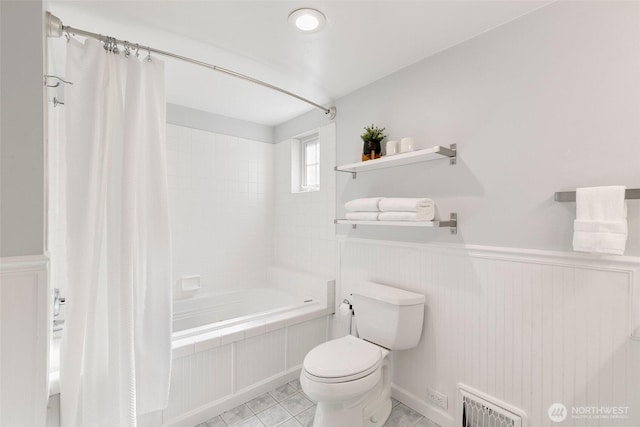 1703 NE 91st St, Seattle, WA 98115 - bathroom featuring shower / tub combo with curtain, a wainscoted wall, and tile patterned floors