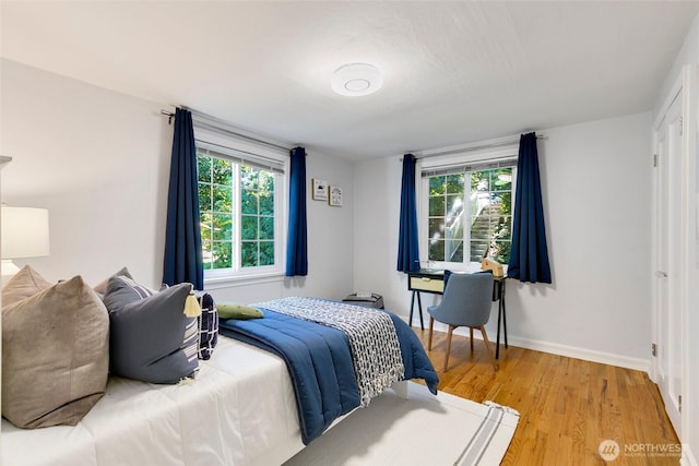 1703 NE 91st St, Seattle, WA 98115 - bedroom with multiple windows and light wood finished floors