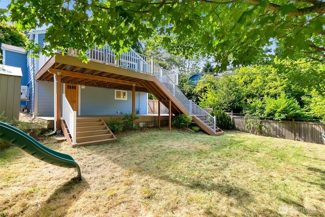 1703 NE 91st St, Seattle, WA 98115 - rear view of property with stairway, a wooden deck, and a playground