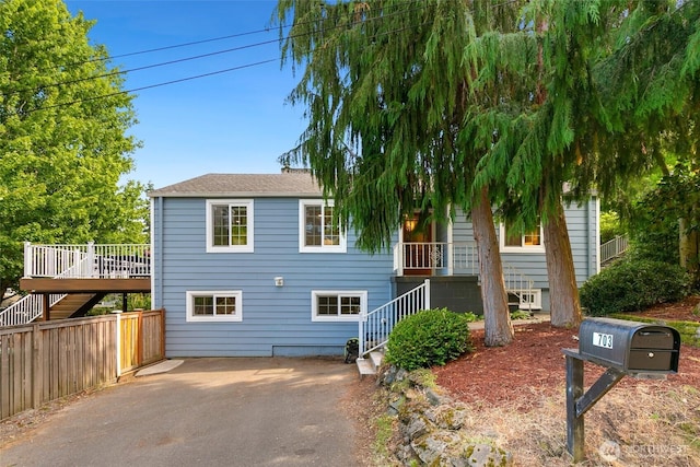 1703 NE 91st St, Seattle, WA 98115 - view of front facade with stairway, driveway, and a wooden deck