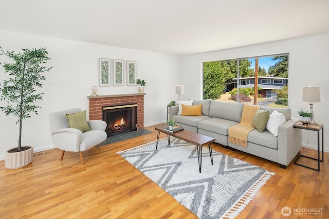 19716 81st Pl W, Edmonds, WA 98026 - living room featuring a brick fireplace and wood finished floors