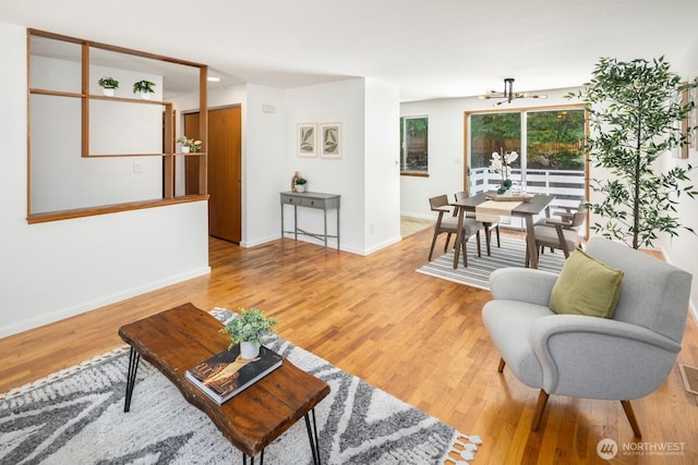 19716 81st Pl W, Edmonds, WA 98026 - living room featuring a chandelier and light wood finished floors