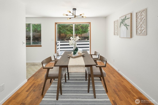 19716 81st Pl W, Edmonds, WA 98026 - dining room featuring a chandelier, wood finished floors, and plenty of natural light