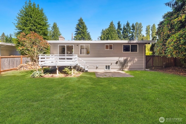19716 81st Pl W, Edmonds, WA 98026 - rear view of house with a wooden deck, a chimney, and a patio area