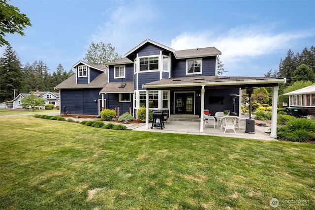 675 Bowker St SE, Lacey, WA 98503 - back of property featuring a patio area and a lawn