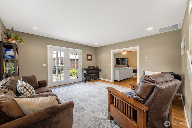 675 Bowker St SE, Lacey, WA 98503 - living room with french doors, light wood-type flooring, recessed lighting, a ceiling fan, and baseboards