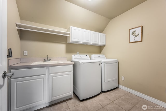 675 Bowker St SE, Lacey, WA 98503 - washroom featuring cabinet space, independent washer and dryer, baseboards, and light tile patterned floors