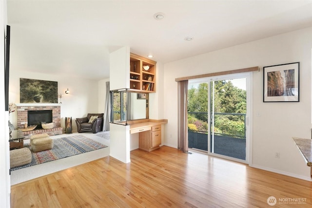 1048 Cassius Ct, Camano Island, WA 98282 - living room featuring light wood finished floors, baseboards, a fireplace, and recessed lighting