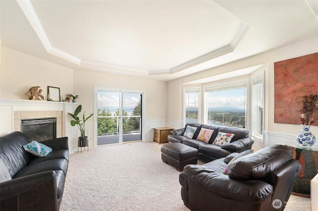 1048 Cassius Ct, Camano Island, WA 98282 - living room with a tray ceiling, a wainscoted wall, healthy amount of natural light, carpet, and ornamental molding