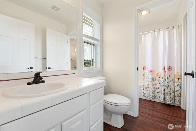 1048 Cassius Ct, Camano Island, WA 98282 - full bathroom with vanity, wood finished floors, toilet, and baseboards