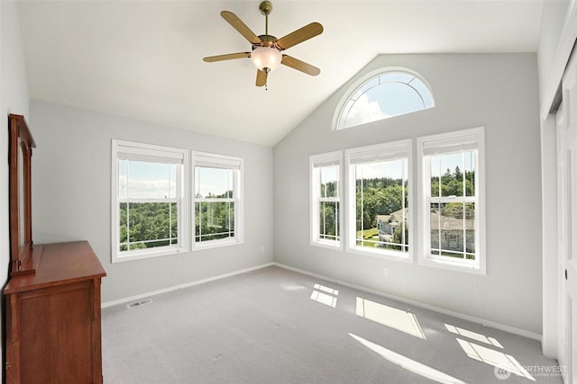 1048 Cassius Ct, Camano Island, WA 98282 - empty room featuring plenty of natural light, carpet floors, baseboards, ceiling fan, and high vaulted ceiling