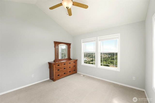 1048 Cassius Ct, Camano Island, WA 98282 - bedroom featuring lofted ceiling, light colored carpet, baseboards, and a ceiling fan