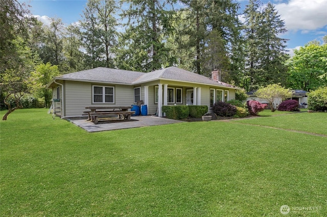 20925 SE Renton-Maple Valley Rd, Maple Valley, WA 98038 - view of front of house featuring a front lawn, a chimney, and a patio