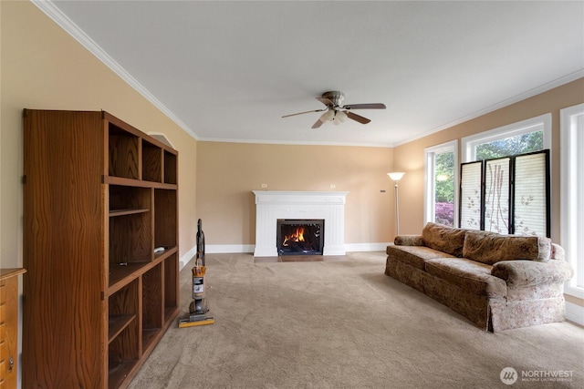 20925 SE Renton-Maple Valley Rd, Maple Valley, WA 98038 - living room with carpet floors, ornamental molding, ceiling fan, a fireplace with flush hearth, and baseboards