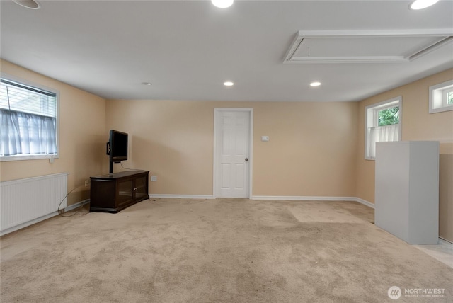 20925 SE Renton-Maple Valley Rd, Maple Valley, WA 98038 - basement featuring radiator heating unit, light carpet, recessed lighting, and baseboards