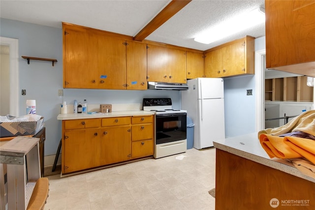 20925 SE Renton-Maple Valley Rd, Maple Valley, WA 98038 - kitchen featuring electric range oven, freestanding refrigerator, under cabinet range hood, light countertops, and brown cabinetry
